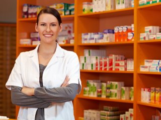 Pharmacy Technician standing in a pharmacy